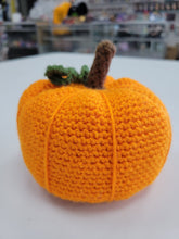 Load image into Gallery viewer, Orange crocheted pumpkin with a brown stem and green vine
